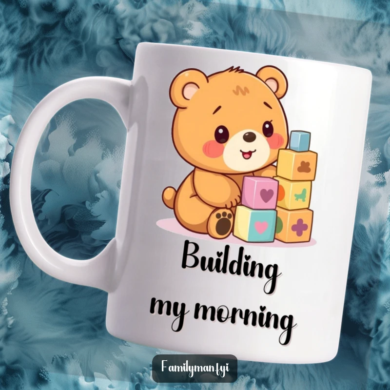 Funny coffee mug showing a cute bear cub concentrating hard while stacking colorful wooden blocks.