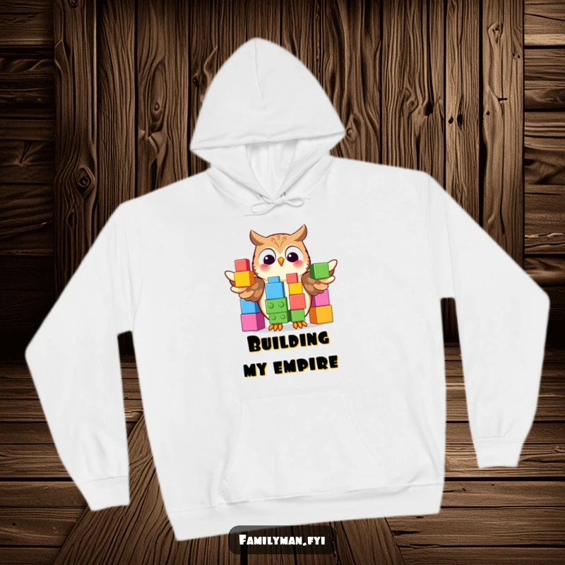 Funny Hoodie with a proud owl displaying a colorful stack of oversized building blocks, offering warm, intelligent comfort.