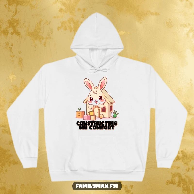Funny playful bunny character building a house with blocks, on a warm hoodie, for cozy creativity.