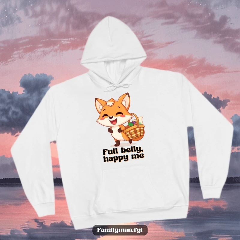 Funny hoodie depicting a joyful fox with a wide, content grin, holding a picnic basket, embodying warmth and happiness.
