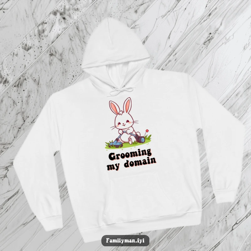 Funny hoodie depicting a cheerful rabbit meticulously mowing a small, tidy lawn, a symbol of diligent care.