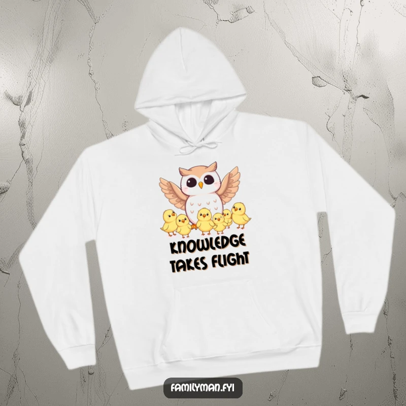 Funny owl character instructing baby birds on flight technique, printed on a warm hoodie. A humorous and cozy wearable.