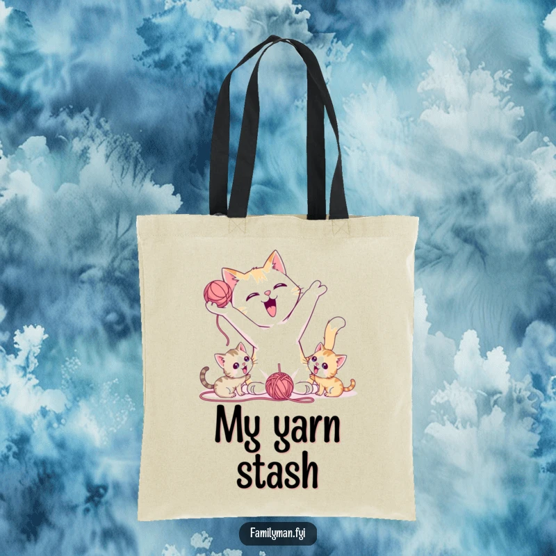 Funny Tote Bag showing a playful father cat tossing a yarn ball for kittens, representing joy and engagement.